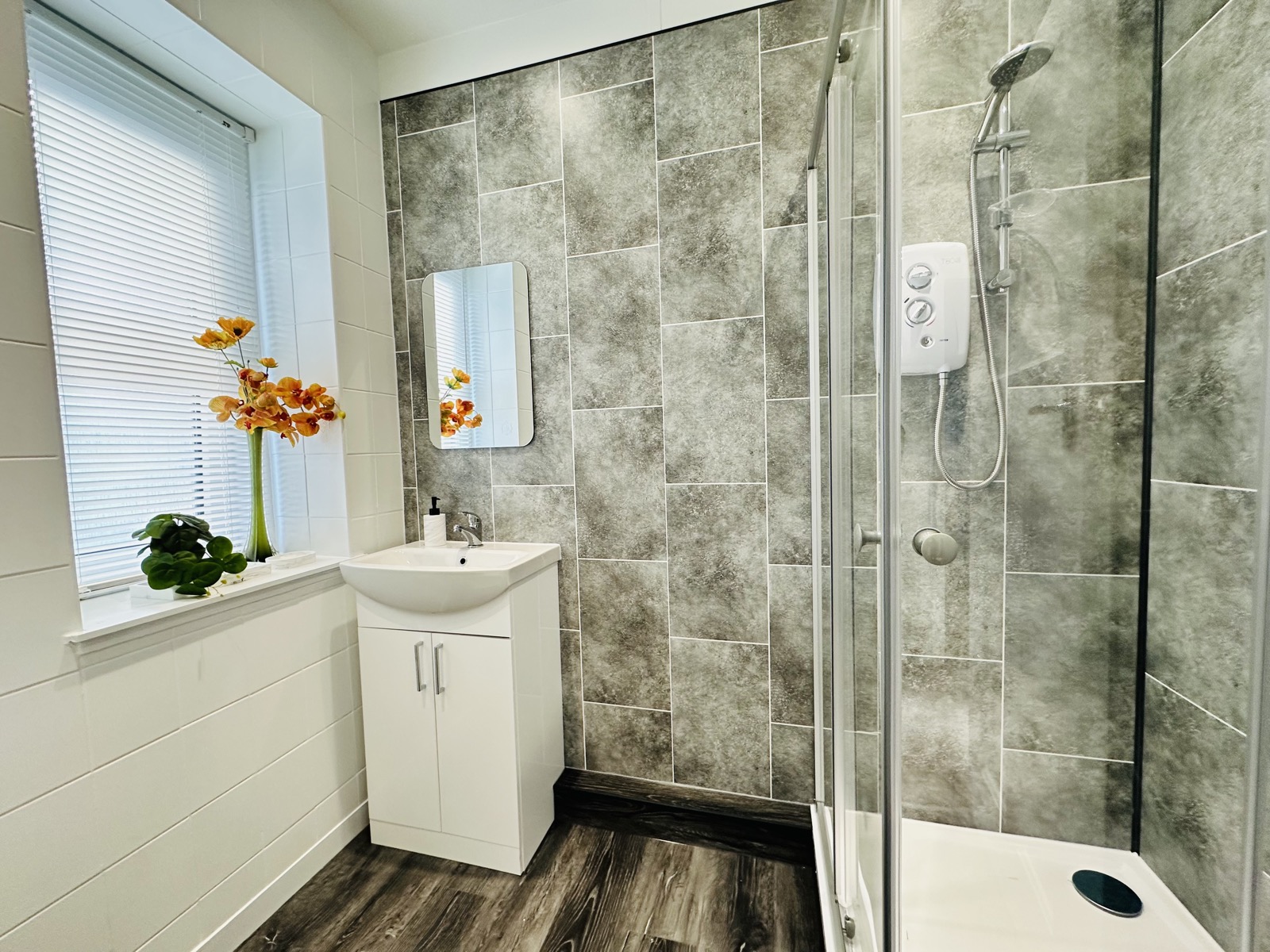 New bathroom with walk-in shower after refurbishment