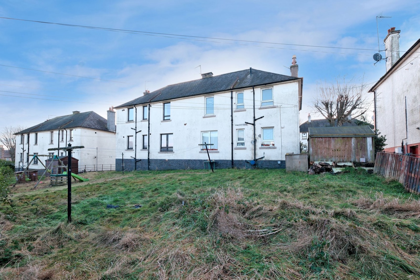 Overgrown rear garden before refurbishment